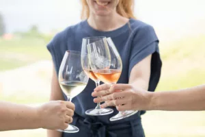 3 glasses of poplar grove wines coming together for a cheers