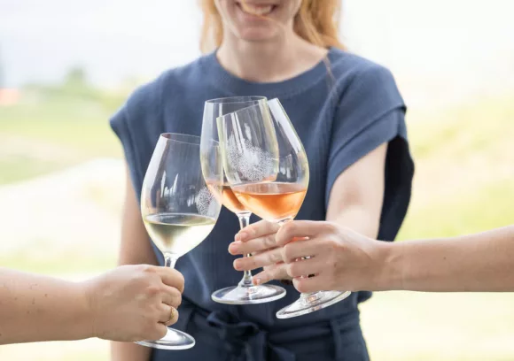 3 glasses of poplar grove wines coming together for a cheers