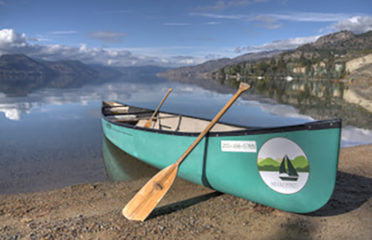 canoe in naramata on the beach at Sandy Beach Lodge