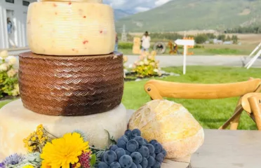 stacked cheese wheels like a wedding cake