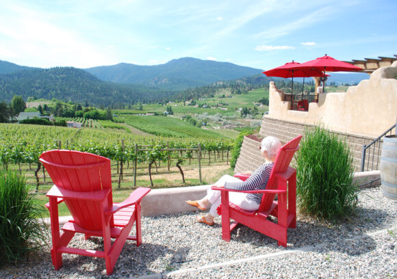 red chairs overlooking vineyard at Thornhaven Winery in Summerland