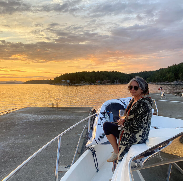 sipping wine on the bow of a boat in the Gulf Islands of British Columbia Canada