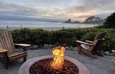 Tofino bon fire and surfing beach at sunset